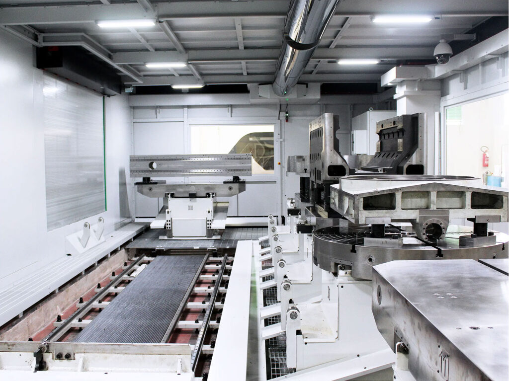 Internal view of the THS 120 Gruppo Parpas cnc machine. Carousel with different tables carrying components of multiple sizes. Sold in the U.K. by Leader CNC Technologies