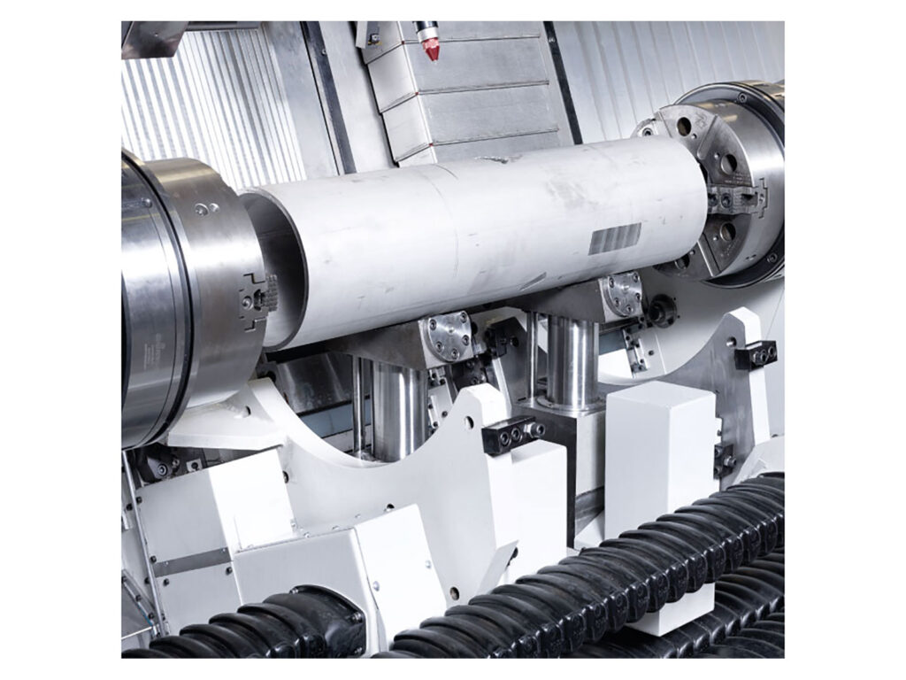 The internal view of a component being produced between two chucks in a FCT FAT Haco lathe, sold by Leader CNC Technologies.