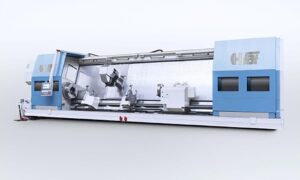 The front view of a large FCTS FAT Haco lathe with doors open, sold by Leader CNC Technologies.