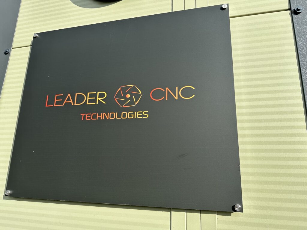 Leader CNC Technologies Logo outside the showroom
