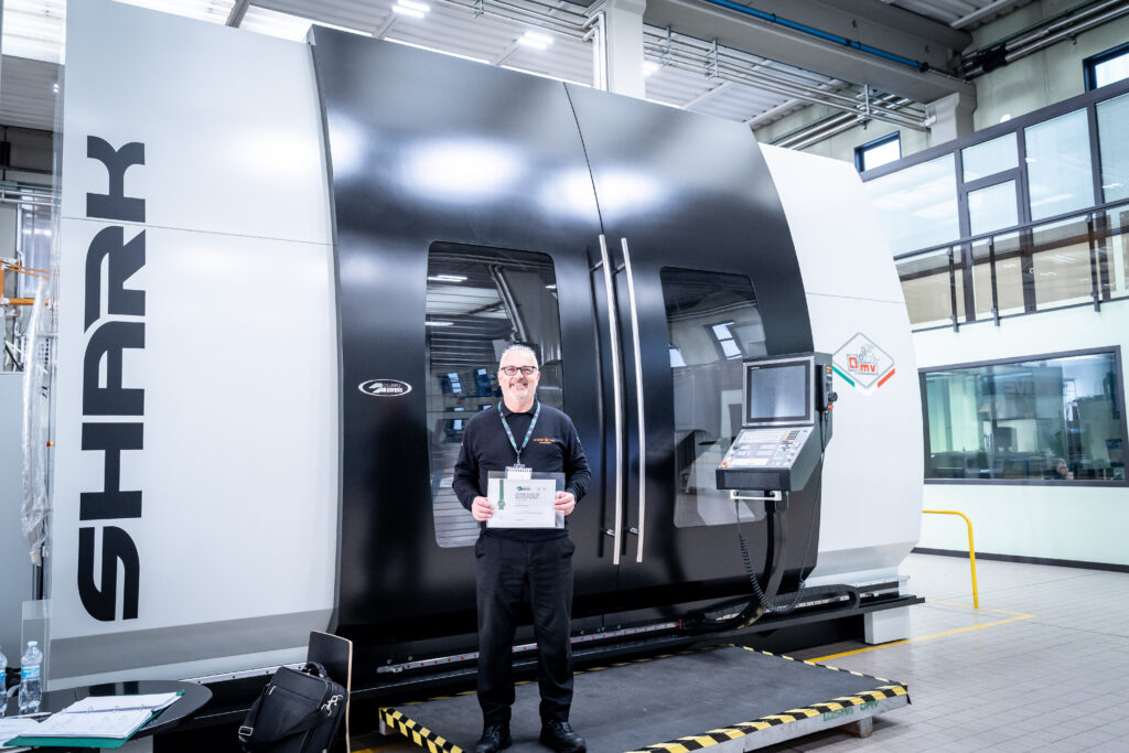 Leader CNC Technologies Service Engineer standing next to Gruppo Parpas SHARK